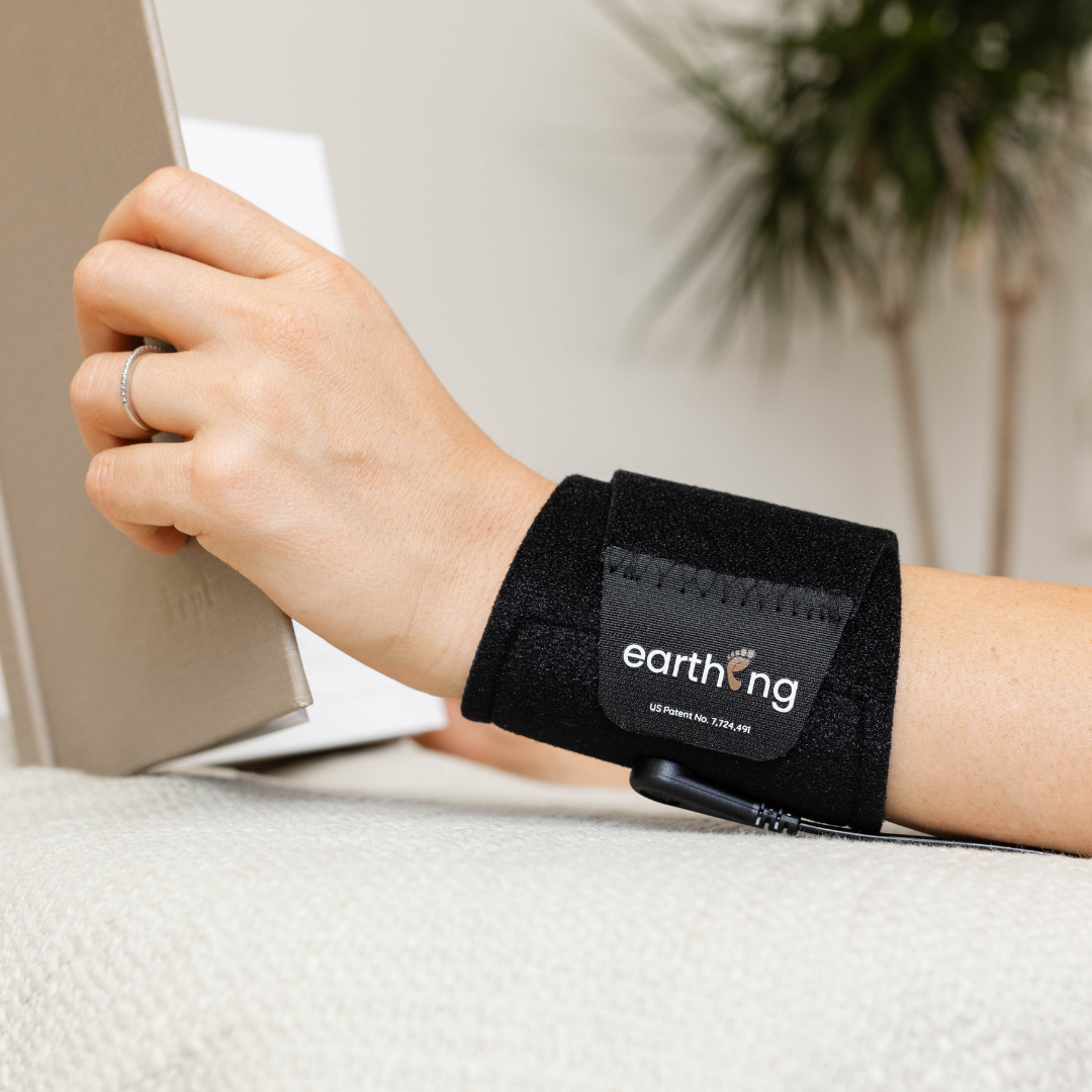 Earthing Uni Band On Wrist Reading Book.Png